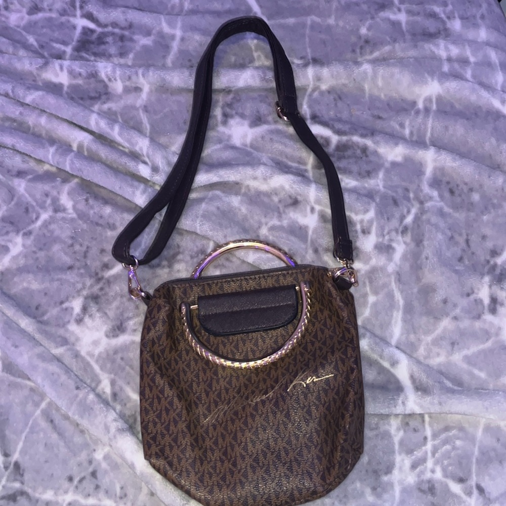 brown and gold Michael Kors crossbody bag